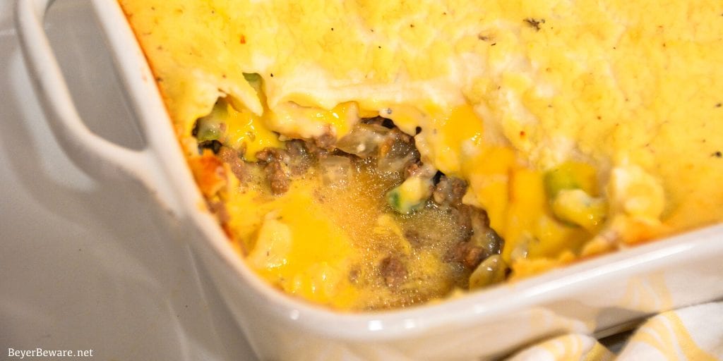 Cheesy Shepherd's Pie is a ground beef casserole filled with mixed vegetables, cheese, cream of mushroom soup, and topped off with mashed potatoes.