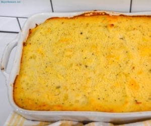 Cheesy Shepherd's Pie is a ground beef casserole filled with mixed vegetables, cheese, cream of mushroom soup, and topped off with mashed potatoes.