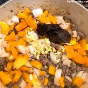 This crock pot taco hamburger and rice soup is a taco-seasoned stuffed pepper soup with a tomato base, rice, bell peppers, onions, and ground beef.