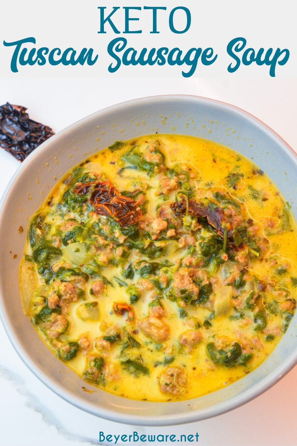 Keto Tuscan sausage soup is a creamy spicy sausage soup with plenty of spinach, sun-dried tomatoes, and spice for an easy and satisfying low-carb soup.