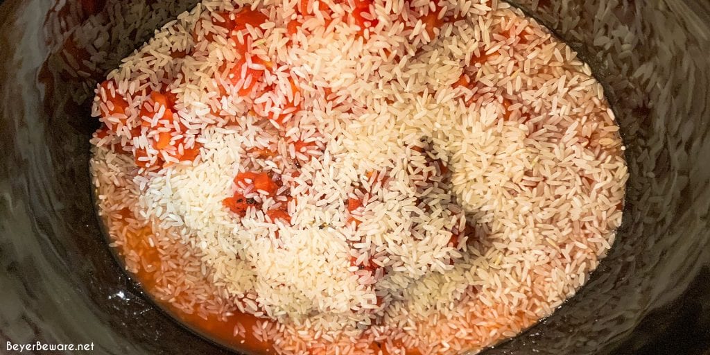 This crock pot taco hamburger and rice soup is a taco-seasoned stuffed pepper soup with a tomato base, rice, bell peppers, onions, and ground beef.