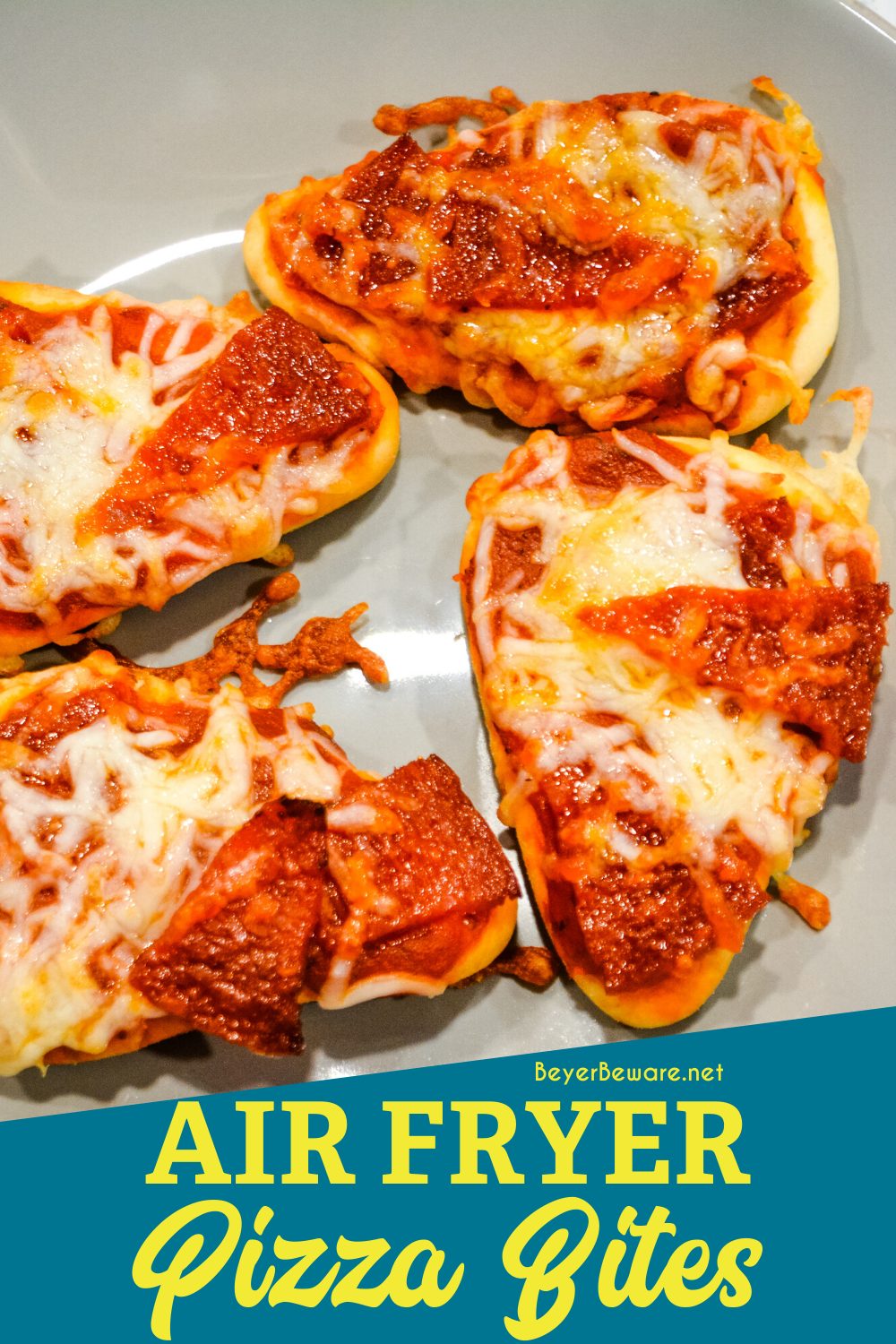 Air fryer pizza bites on naan bread are a simple snack or lunch made with naan bites, pizza sauce, pepperoni, and cheese and cook quickly in the air fryer or Ninja Foodi.