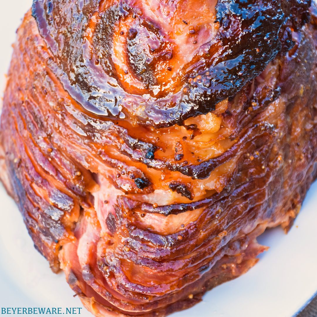 Apricot bourbon-glazed ham on the grill is a sweet and salty combination of flavors with apricot jam, mustard, maple syrup, lemon juice, and bourbon and then smoke drenched on the Big Green Egg.