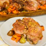 Sheet pan pork chops, sweet potatoes, and red potatoes are a garlic brown sugar pork chops recipe baked on top of roasted sweet potatoes and red potatoes.