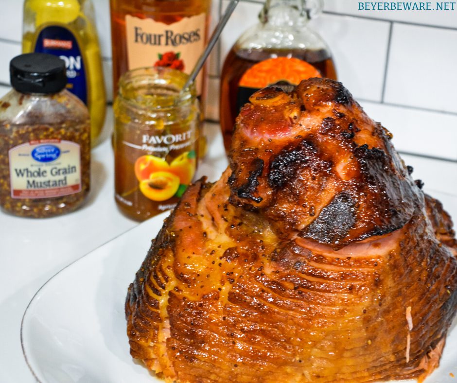Apricot bourbon-glazed ham on the grill is a sweet and salty combination of flavors with apricot jam, mustard, maple syrup, lemon juice, and bourbon and then smoke drenched on the Big Green Egg.