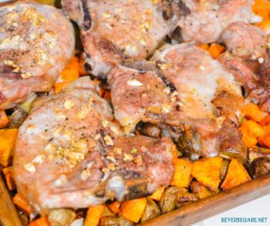 Sheet pan pork chops, sweet potatoes, and red potatoes are a garlic brown sugar pork chops recipe baked on top of roasted sweet potatoes and red potatoes.