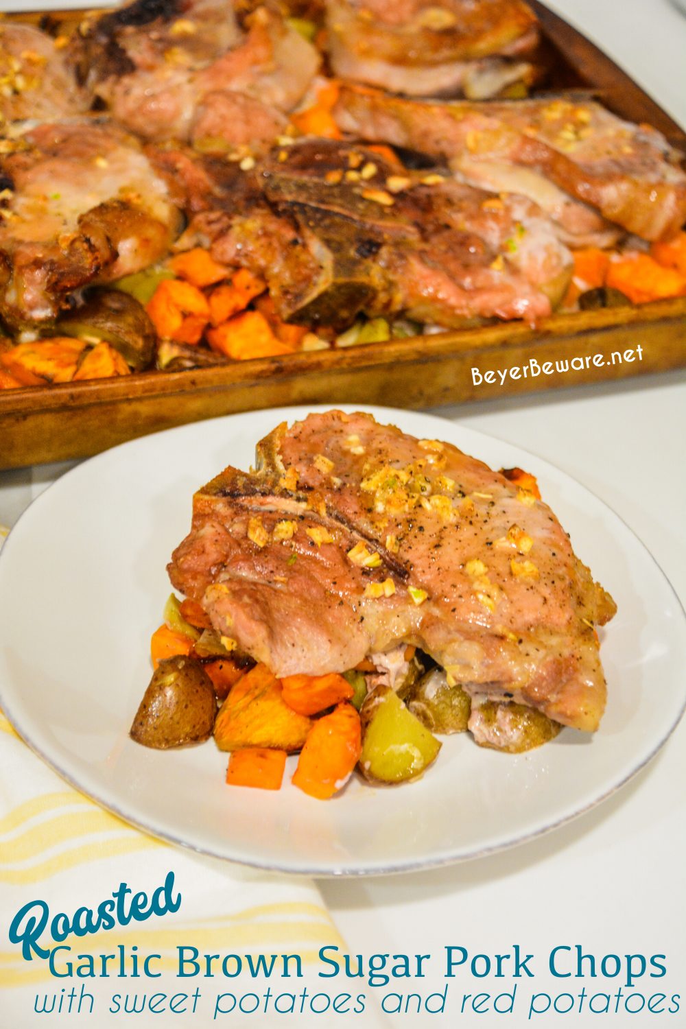 Sheet pan pork chops, sweet potatoes, and red potatoes are a garlic brown sugar pork chops recipe baked on top of roasted sweet potatoes and red potatoes.