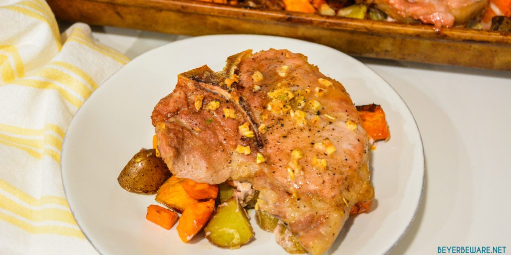 Sheet pan pork chops, sweet potatoes, and red potatoes are a garlic brown sugar pork chops recipe baked on top of roasted sweet potatoes and red potatoes.