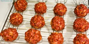 Bacon cheeseburger stuffed meatballs on the grill are the perfect grilled meatball made with bacon bits, fried onions, ground beef, and a cube of Colby jack cheese.