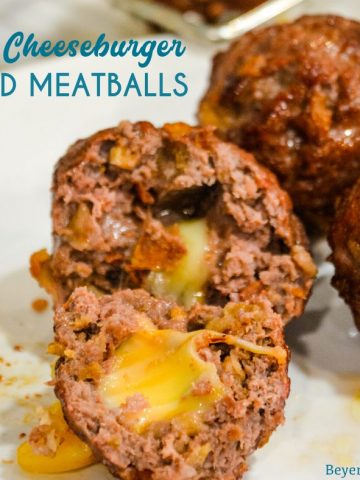 Bacon cheeseburger stuffed meatballs on the grill are the perfect grilled meatball made with bacon bits, fried onions, ground beef, and a cube of Colby jack cheese.