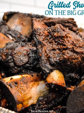 Grilled beef short ribs on the Big Green Egg are smoked with a beef barbecue rub and then slow-cooked to their final temperature in a bath of red wine, butter, and beef broth. 