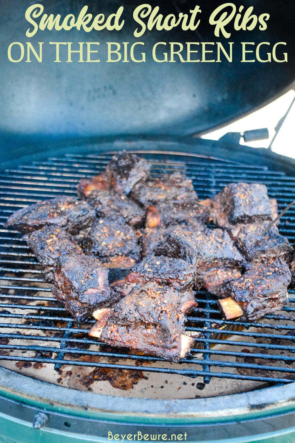 Grilled beef short ribs on the Big Green Egg are smoked with a beef barbecue rub and then slow-cooked to their final temperature in a bath of red wine, butter, and beef broth. 