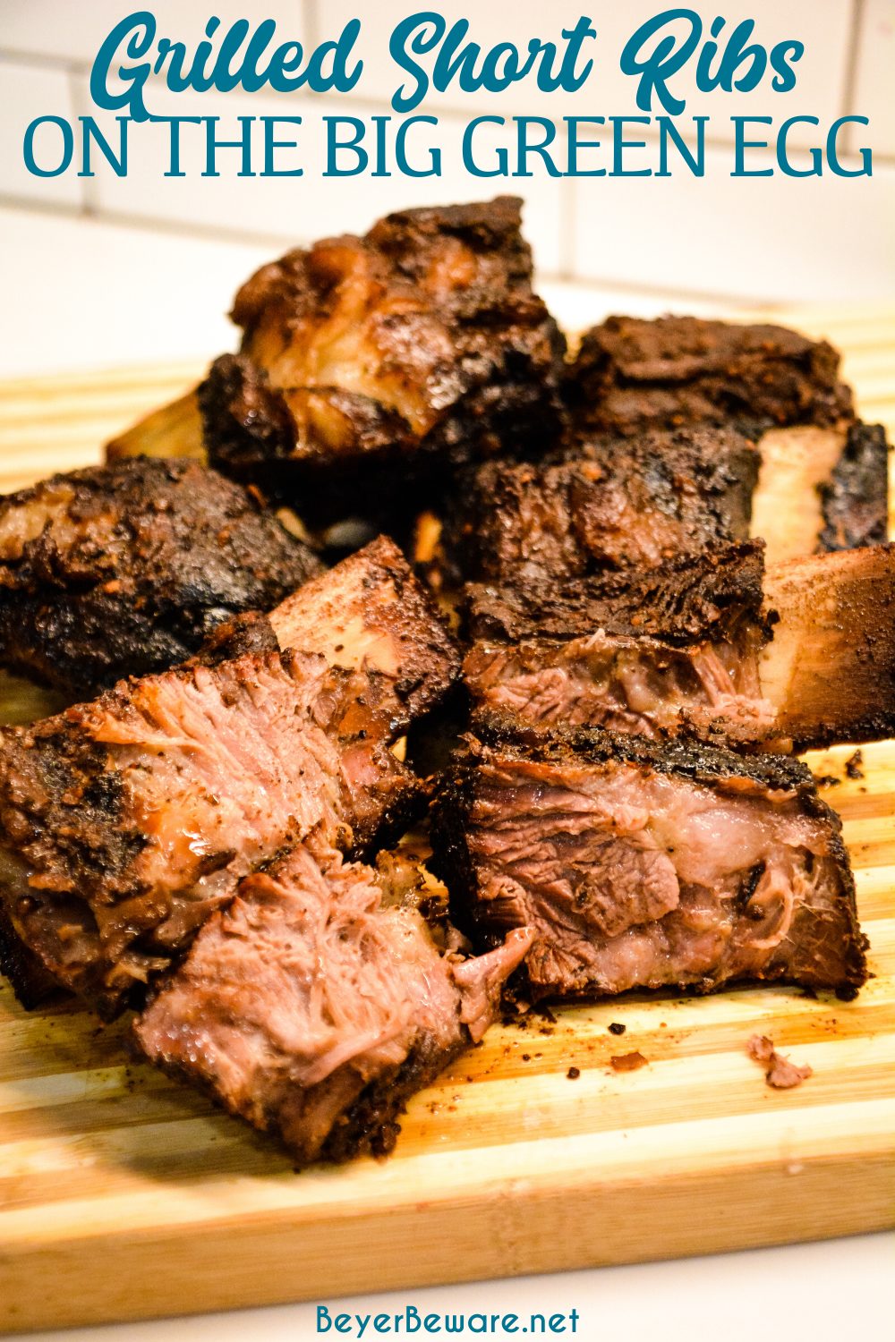 Grilled beef short ribs on the Big Green Egg are smoked with a beef barbecue rub and then slow-cooked to their final temperature in a bath of red wine, butter, and beef broth. 