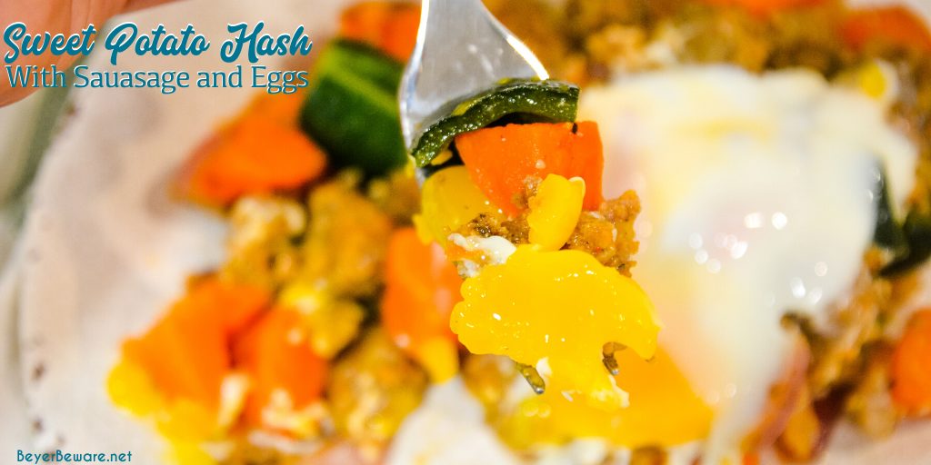 Sweet potato hash with sausage and eggs is a hearty breakfast skillet made with diced sweet potatoes, spicy sausage, onions, and poblano peppers with fried or poached eggs over the top.