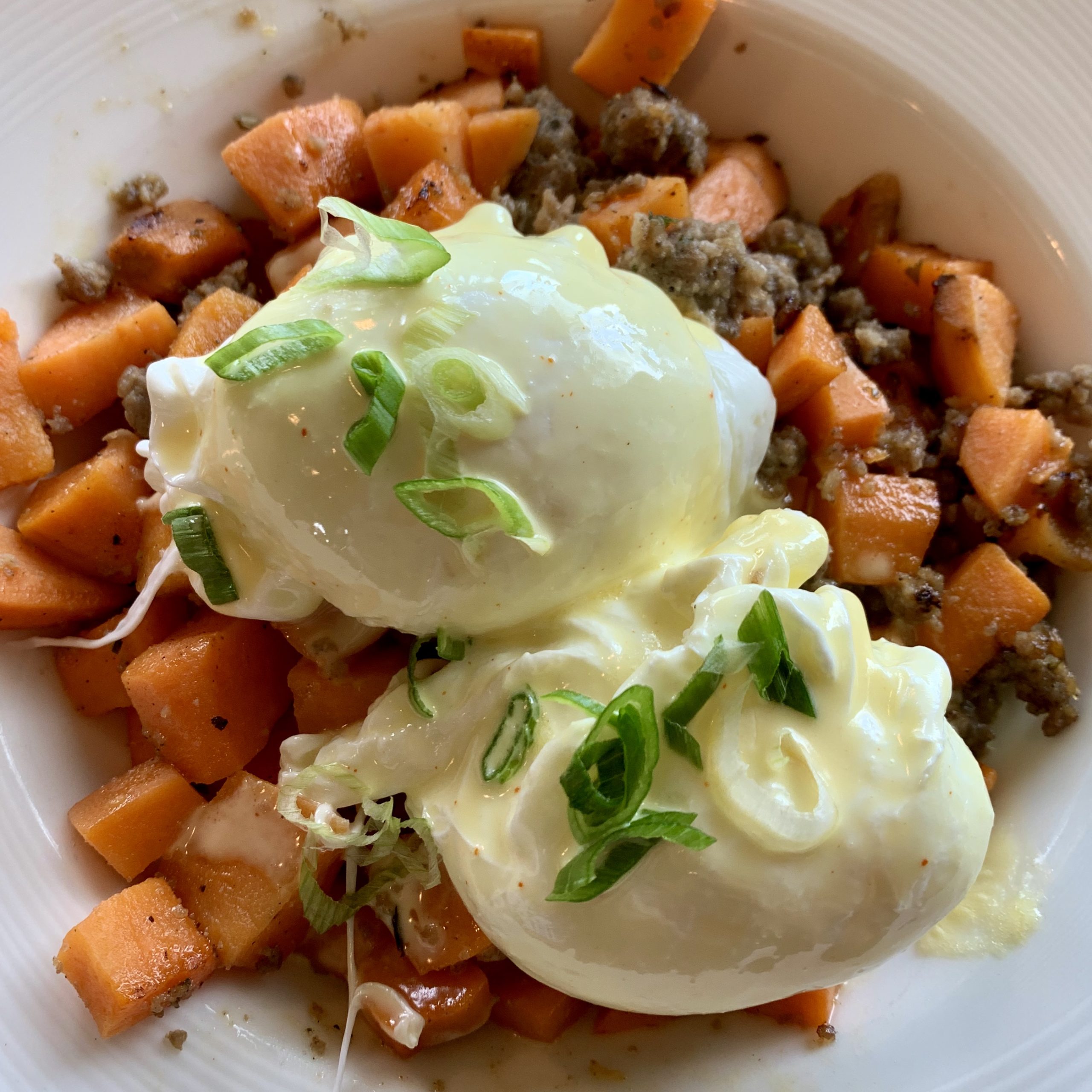 Sweet Potato Hash with sausage and eggs is a meal I had while on a girl's weekend up in Petosky, Michigan last fall.