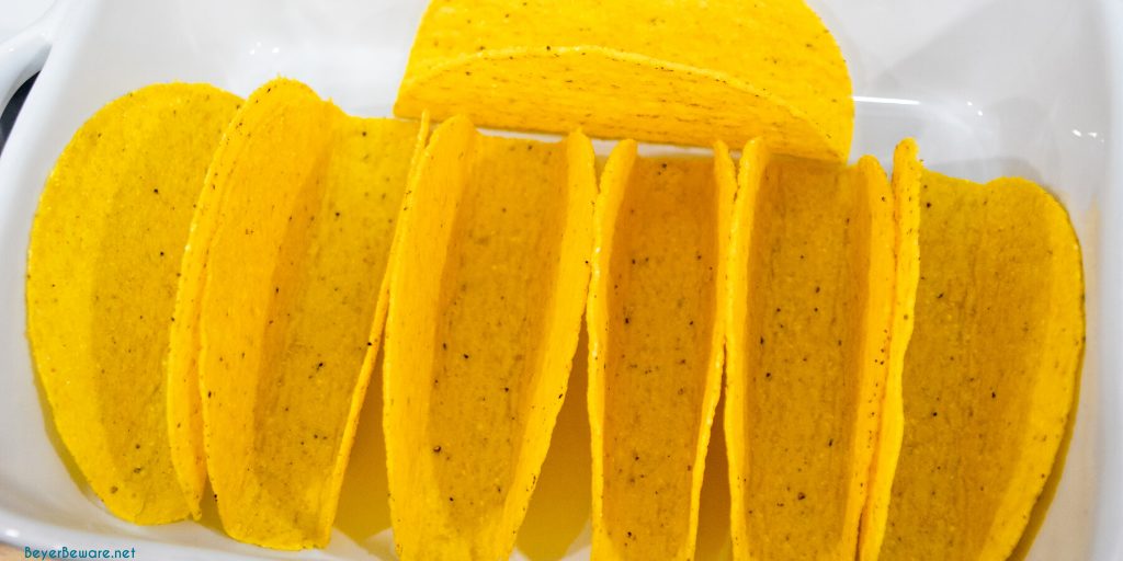 Taco shells in a rectangular pan.