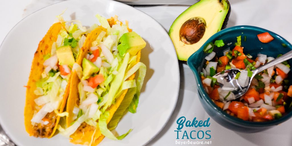 Creamy ground beef baked tacos are made with corn or flour shells, ground beef, taco seasoning, cream cheese, and salsa before topping with shredded cheese.