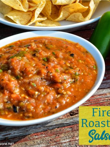 Fire-roasted salsa recipe takes garden fresh tomatoes, jalapenos, onions, garlic, and cilantro to the grill for a flame-grilled salsa recipe that is outrageously good and easy to make.