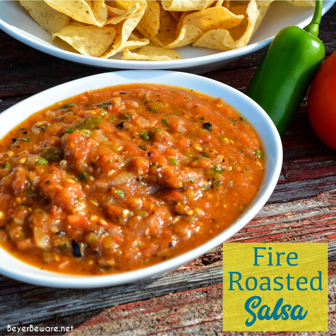 Fire-roasted salsa recipe takes garden fresh tomatoes, jalapenos, onions, garlic, and cilantro to the grill for a flame-grilled salsa recipe that is outrageously good and easy to make.