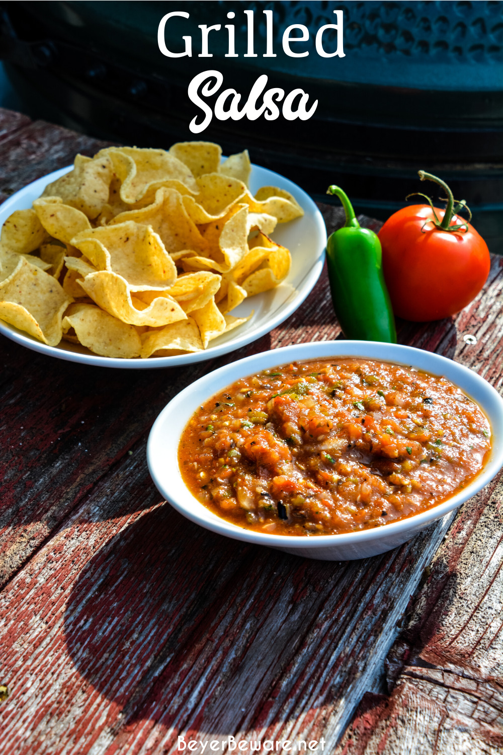 Fire-roasted salsa recipe takes garden fresh tomatoes, jalapenos, onions, garlic, and cilantro to the grill for a flame-grilled salsa recipe that is outrageously good and easy to make.