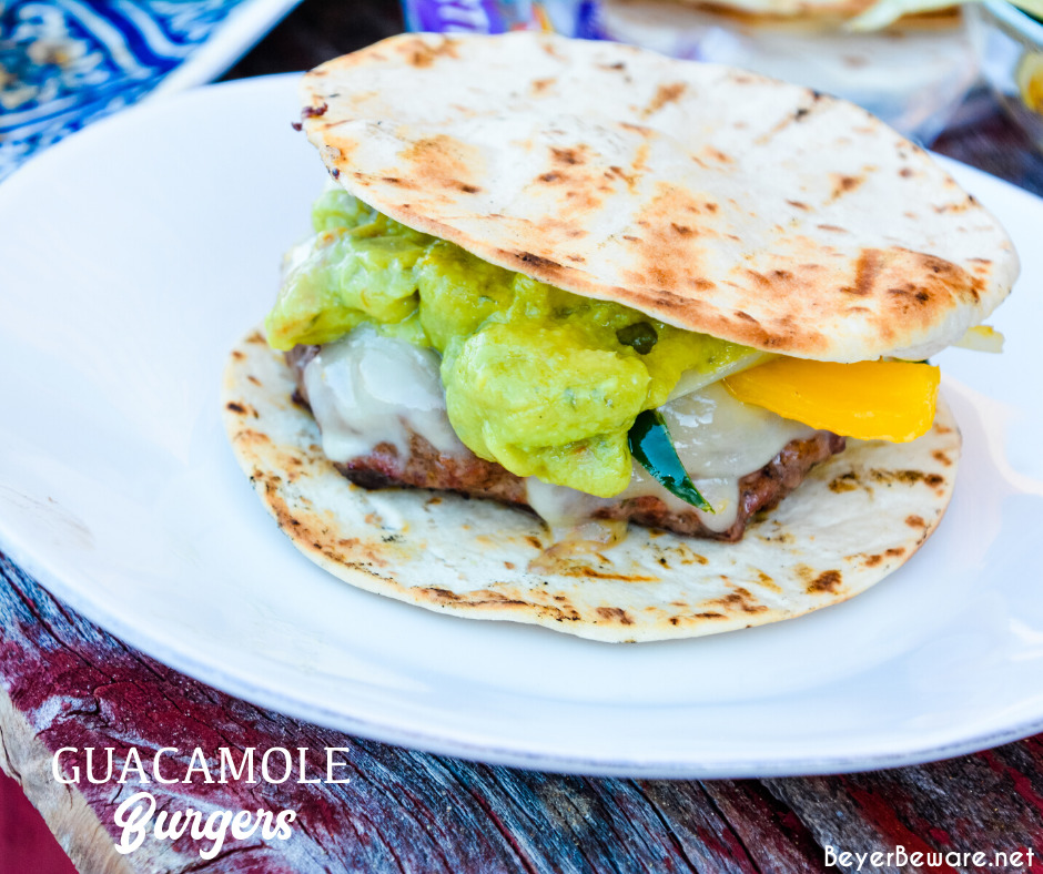 Guacamole burgers combine taco night with burger night straight from the grill with flavorful burgers, pepper-jack cheese, guacamole, sauteed onions, peppers, and street taco tortilla shells.