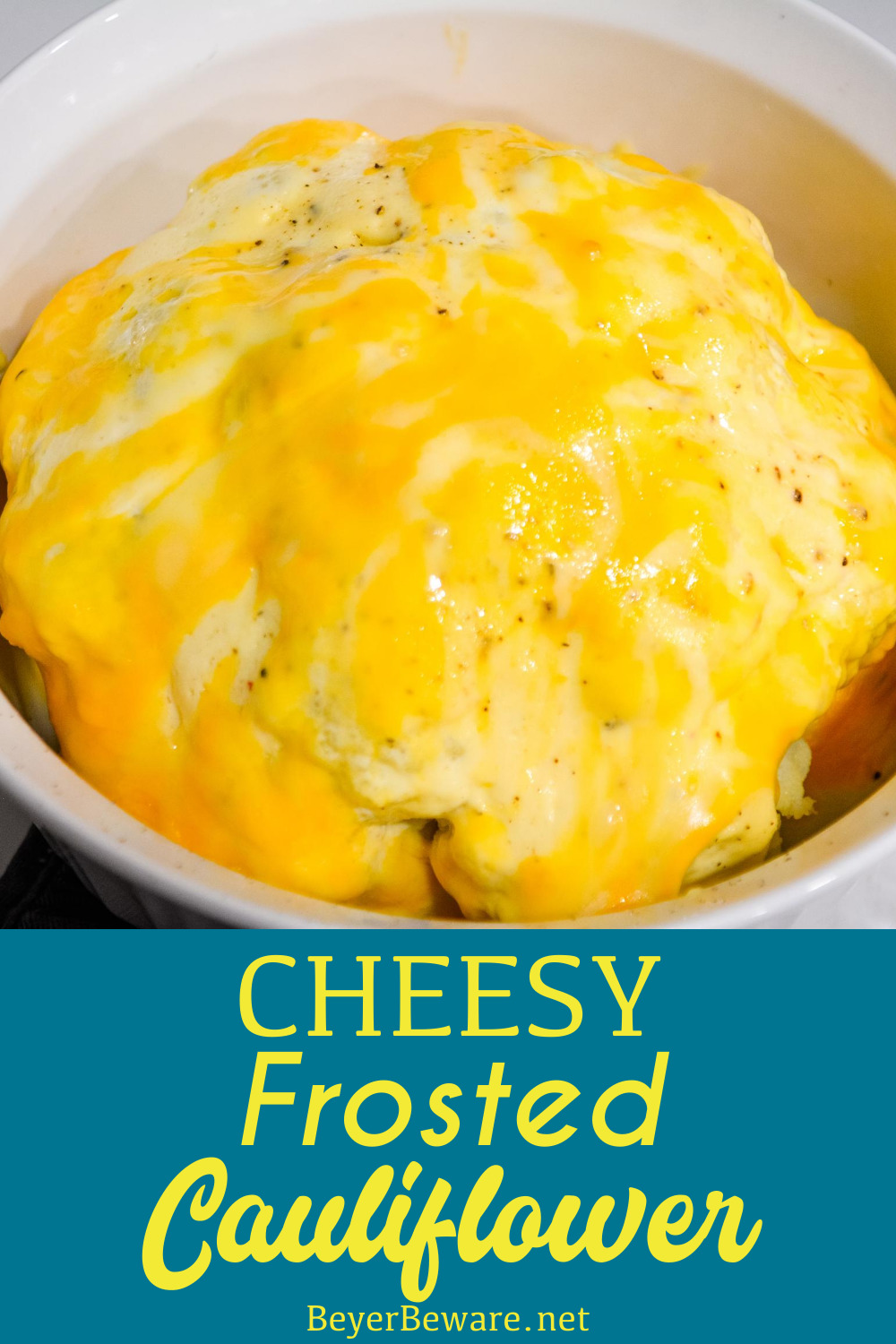 Cheesy Frosted Cauliflower is a whole head of cauliflower, steamed and then frosted with a combination of mayonnaise and mustard and then covered in cheese before quickly roasting in the oven.