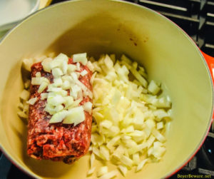 Cheesy hamburger and noodle casserole is an easy dinner recipe made with ground beef, noodles, tomato soup, and cheese for homemade hamburger helper kind of meal.