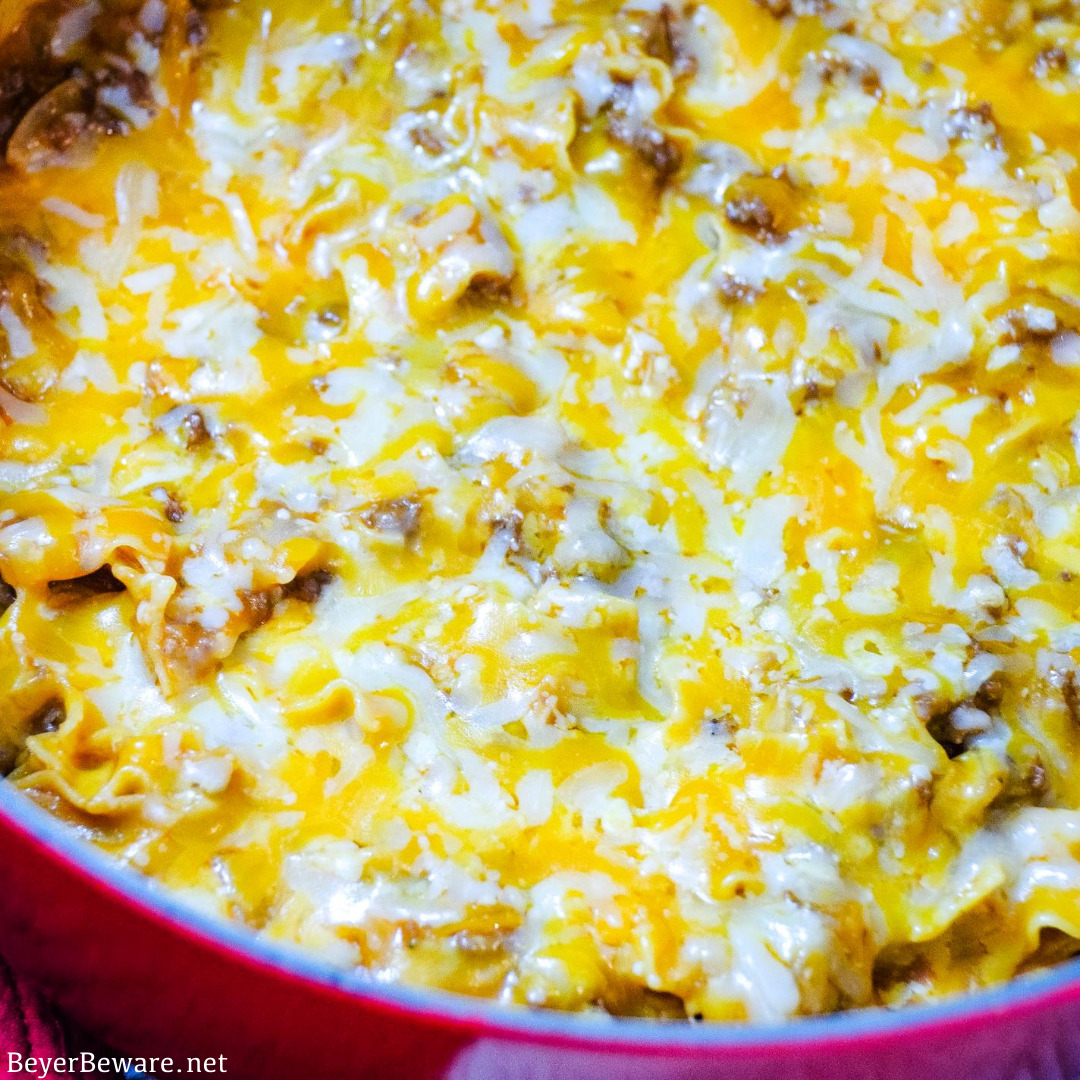 Cheesy hamburger and noodle casserole is an easy dinner recipe made with ground beef, noodles, tomato soup, and cheese for homemade hamburger helper kind of meal.