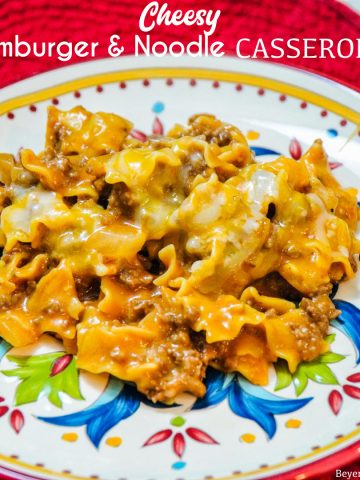 Cheesy hamburger and noodle casserole is an easy dinner recipe made with ground beef, noodles, tomato soup, and cheese for homemade hamburger helper kind of meal.