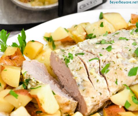 Crock pot pork loin roast and potatoes is an easy dump and go crock pot pot ranch pork loin recipe that will look and taste fancy when you serve it for dinner.