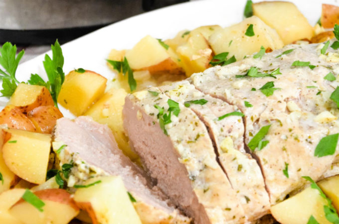 Crock pot pork loin roast and potatoes is an easy dump and go crock pot pot ranch pork loin recipe that will look and taste fancy when you serve it for dinner.