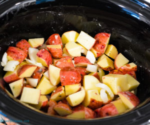 Ranch potatoes in the crock pot for the bed to put the pork loin roast on.