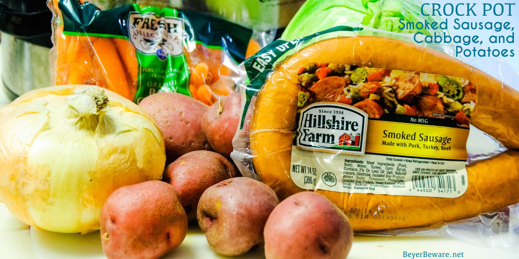 Crock Pot smoked sausage, cabbage, and potatoes is an easy dinner idea using garden fresh vegetables like cabbage, potatoes, onions, and carrots that have been slow cooked in the juices from the smoked sausage.