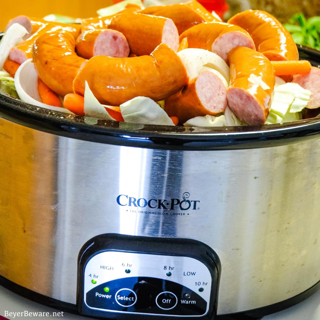 Crock Pot smoked sausage, cabbage, and potatoes is an easy dinner idea using garden fresh vegetables like cabbage, potatoes, onions, and carrots that have been slow cooked in the juices from the smoked sausage.