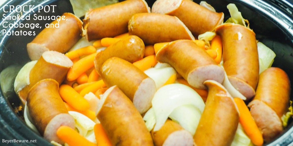 Crock Pot smoked sausage, cabbage, and potatoes is an easy dinner idea using garden fresh vegetables like cabbage, potatoes, onions, and carrots that have been slow cooked in the juices from the smoked sausage.