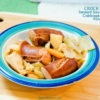 Crock Pot smoked sausage, cabbage, and potatoes is an easy dinner idea using garden fresh vegetables like cabbage, potatoes, onions, and carrots that have been slow cooked in the juices from the smoked sausage.