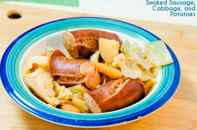 Crock Pot smoked sausage, cabbage, and potatoes is an easy dinner idea using garden fresh vegetables like cabbage, potatoes, onions, and carrots that have been slow cooked in the juices from the smoked sausage.
