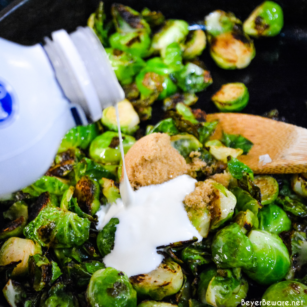 Brussels sprouts with pecans and honey is a cast iron skillet brussels sprout recipe that is a little sweet, nutty with a light cream sauce that is topped off with a drizzle honey.