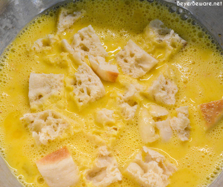 After whisking the eggs, add the English muffin cubes to the eggs. Stir