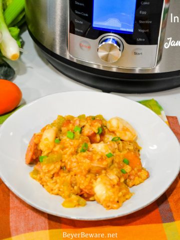 Instant Pot Jambalaya is a quick cajun recipe with spicy andouille sausage, chicken, shrimp, and rice pressure cooked in onions, celery, peppers, garlic, tomatoes, and creole seasonings.