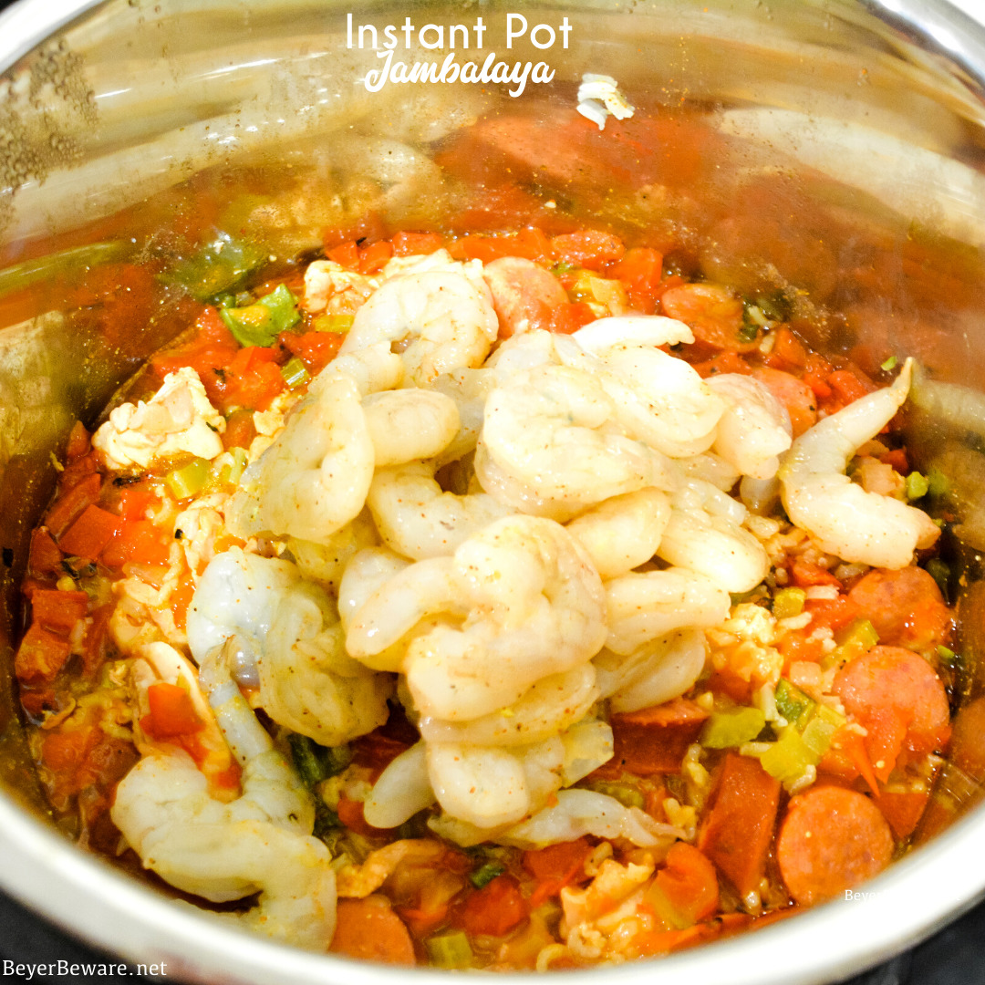 Instant Pot Jambalaya is a quick cajun recipe with spicy andouille sausage, chicken, shrimp, and rice pressure cooked in onions, celery, peppers, garlic, tomatoes, and creole seasonings.