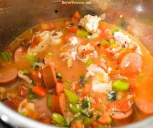 Instant Pot Jambalaya is a quick cajun recipe with spicy andouille sausage, chicken, shrimp, and rice pressure cooked in onions, celery, peppers, garlic, tomatoes, and creole seasonings.