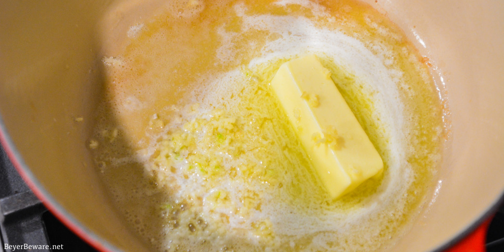 Melting butter and sauteing garlic for over the top mac and cheese.