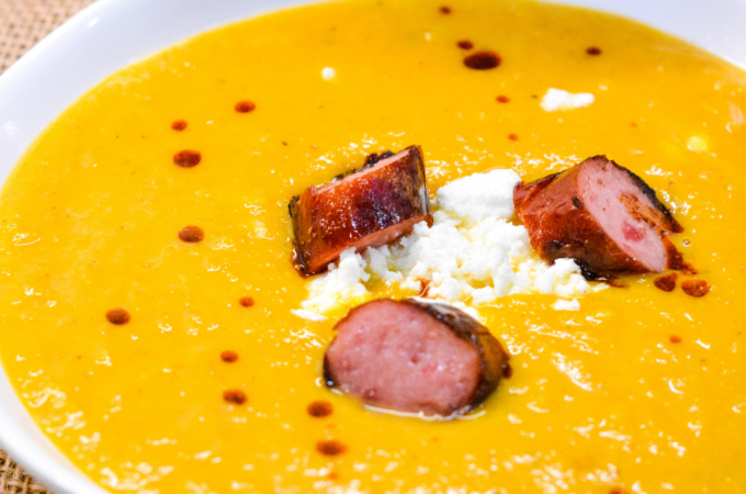 Butternut squash soup with smoked sausage is a savory, creamy roasted butternut squash soup with hints of chili, sage, onion and feta for a delish fall soup.