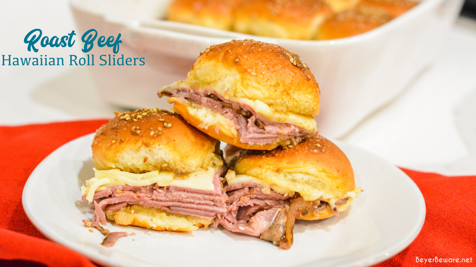 Roast beef Hawaiian roll sliders, or more affectionately called Sandy's Sandwiches, combine butter, garlic powder, worcestershire sauce, and poppy seeds for a butter glaze that compliments these baked roast beef and cheese sandwiches.