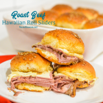 Roast beef Hawaiian roll sliders, or more affectionately called Sandy's Sandwiches, combine butter, garlic powder, worcestershire sauce, and poppy seeds for a butter glaze that compliments these baked roast beef and cheese sandwiches.