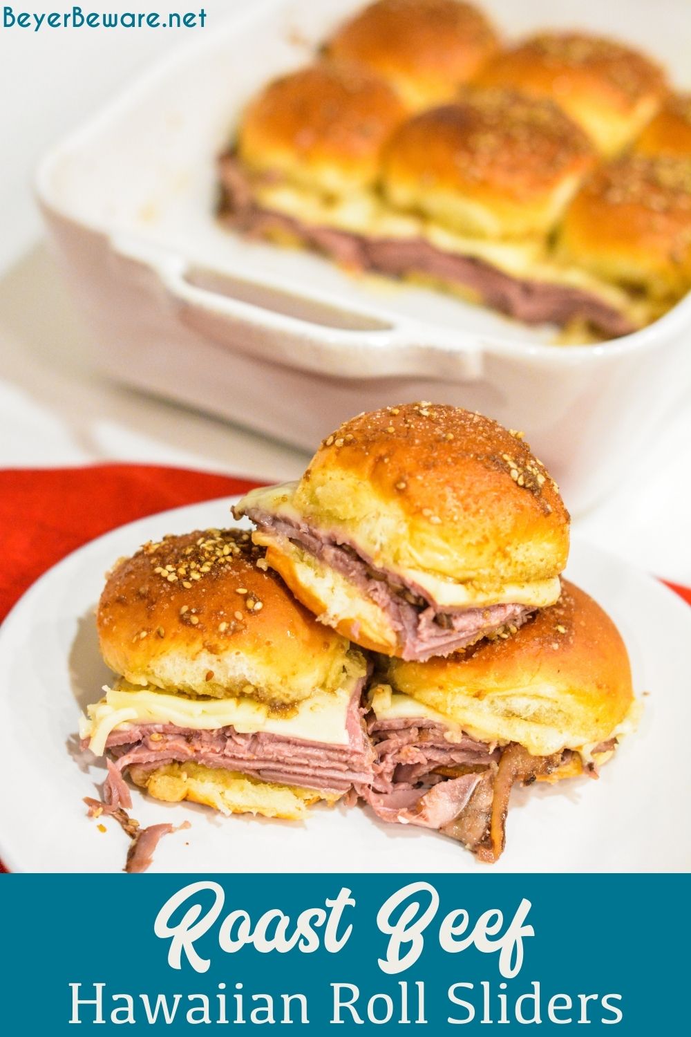 Roast beef Hawaiian roll sliders, or more affectionately called Sandy's Sandwiches, combine butter, garlic powder, Worcestershire sauce, and poppy seeds for a butter glaze that compliments these baked roast beef and cheese sandwiches.