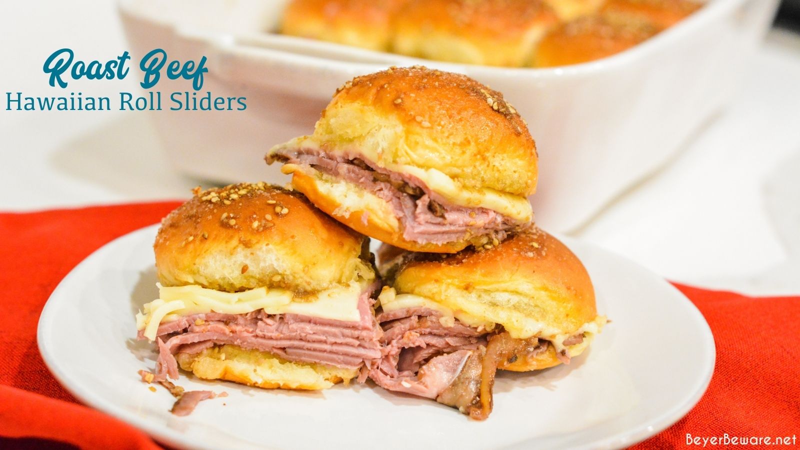 Roast beef Hawaiian roll sliders, or more affectionately called Sandy's Sandwiches, combine butter, garlic powder, Worcestershire sauce, and poppy seeds for a butter glaze that compliments these baked roast beef and cheese sandwiches.