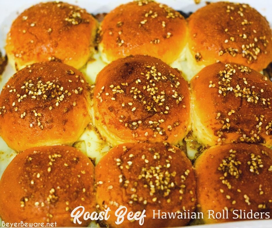 Roast beef Hawaiian roll sliders, or more affectionately called Sandy's Sandwiches, combine butter, garlic powder, Worcestershire sauce, and poppy seeds for a butter glaze that compliments these baked roast beef and cheese sandwiches.