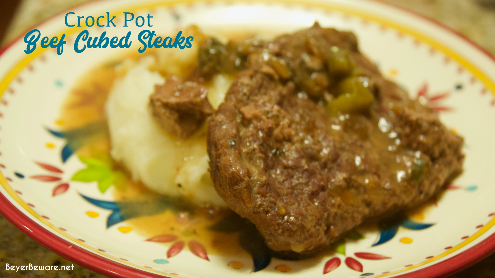 Crock pot beef cubed steak with gravy is a simple recipe that combines ranch and Italian seasoning and cream of mushroom soup and French onion soup with mushrooms, onions, and peppers for a tender cubed steak recipe that is perfect over mashed potatoes.